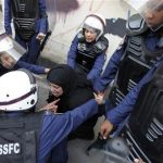 Riot policewomen arrest an anti-government protester during a demonstration in capital Manama, September 21, 2012. REUTERS/Hamad I Mohammed