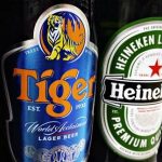 Bottles of Tiger and Heineken beers are pictured on the shelf of a grocery store in Singapore in this July 20, 2012 file photo. REUTERS/Tim Chong/Files