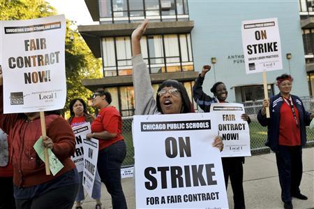 Chicago teachers walk the picket line outside Anthony Overton School in Chicago September 10, 2012. REUTERS/Jean Lachat