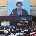 Lebanon's Hezbollah leader Sayyed Hassan Nasrallah addresses his supporters via a screen, during a rally marking "Quds (Jerusalem) Day",in the southern suburbs of Beirut, August 17, 2012. REUTERS/Sharif Karim