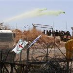 Israeli soldiers use a truck to fire a water cannon containing a foul smelling substance during a protest against the controversial Israeli barrier in the West Bank village of Bilin, near Ramallah July 17, 2009. REUTERS/Darren Whiteside