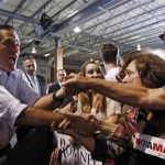 U.S. Republican presidential nominee and former Massachusetts Governor Mitt Romney (L) greets supporters at a campaign rally in Miami, Florida September 19, 2012. REUTERS/Jim Young