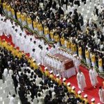 Honor guards carry the body of Sun Myung Moon as his family members follow during a funeral service for the late founder of the Unification Church, at the CheongShim Peace World Center in Gapyeong, about 60 km (37 miles) northeast of Seoul September 15, 2012. REUTERS/Lee Jae-Won