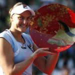 Nadia Petrova of Russia poses with her victory trophy after defeating Agnieszka Radwanska of Poland in their final match at the Pan Pacific Open tennis tournament in Tokyo September 29, 2012. REUTERS/Toru Hanai
