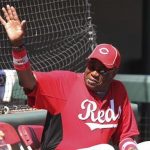 Cincinnati Reds' manager Dusty Baker waves to fans before their spring training game against the Los Angeles Angels of Anaheim at Tempe Diablo Stadium in Tempe, Arizona March 15, 2012. REUTERS/Darryl Webb