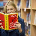 A woman poses with a copy of author J K Rowling's first adult fiction book The Casual Vacancy after it went on sale at a bookshop in central London, September 27, 2012. REUTERS/Neil Hall