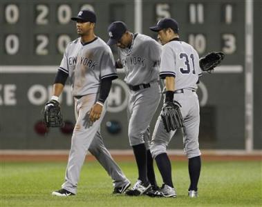 New York Yankees' Chris Dickerson (L) celebrates with his teammates Curtis Granderson (C) and Ichiro Suzuki at the end of the ninth inning of American League MLB baseball action against the Boston Red Sox at Fenway Park in Boston, Massachusetts September 12, 2012. REUTERS/Jessica Rinaldi