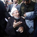 Egyptian cleric Sheikh Yousef al-Qaradawi arrives to lead the Friday prayers in Tahrir Square in Cairo February 18, 2011. REUTERS/Suhaib Salem