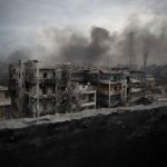 Smoke rises over Saif Al Dawla district in Aleppo, Syria, Tuesday, Oct. 2, 2012.