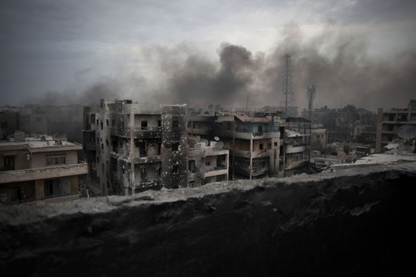 Smoke rises over Saif Al Dawla district in Aleppo, Syria, Tuesday, Oct. 2, 2012.