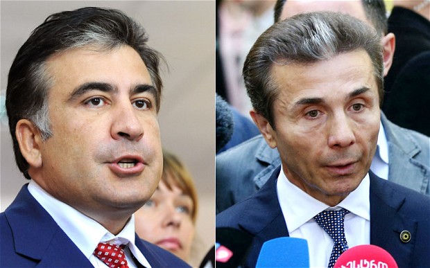 Opposition leader Bidzina Ivanishvili, right, was quick to claim he had won the popular vote against President Mikheil Saakashvili