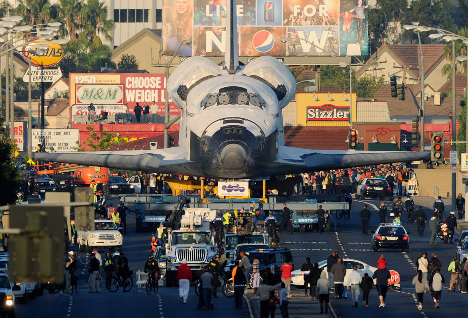 The space shuttle Endeavour is transported to The Forum arena for a stopover and celebration on its way to the California Science Center from Los Angeles International Airport (LAX) on day two on October 12, 2012 in Inglewood, California. The space shuttle Endeavour is on 12-mile journey from Los Angeles International Airport to the California Science Center to go on permanent public display