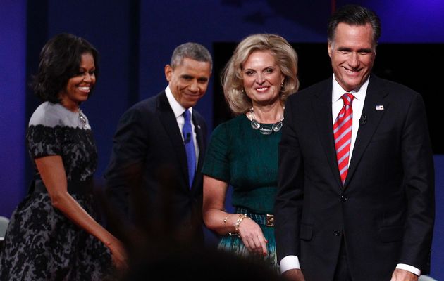 U.S. President Barack Obama and first lady Michelle Obama walk behind U.S. Republican presidential candidate and former Massachusetts Governor Mitt Romney and his wife Ann at the end of the final U.S. presidential debate in Boca Raton, Florida, October 22, 2012
