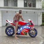 Wyclef Jean oils himself up and poses naked on a motorbike (what do you mean 'why?')