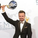 Aaron Paul raises the Emmy award for outstanding supporting actor for a drama series for his role in "Breaking Bad" at the 64th Primetime Emmy Awards in Los Angeles September 23, 2012. REUTERS/Mario Anzuoni