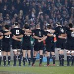 The All Blacks link arms as they sing the national anthem for their test match against Ireland at Eden Park in Auckland June 9, 2012. REUTERS/Nigel Marple