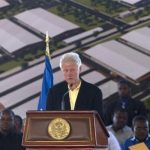 Clintons land in Haiti to showcase industrial park