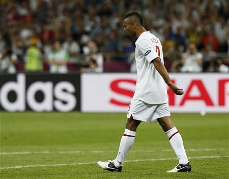 England's Ashley Cole reacts after missing a penalty during the penalty shoot-out in their Euro 2012 quarter-final soccer match against Italy at the Olympic Stadium in Kiev, June 24, 2012. REUTERS/Tony Gentile