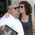 Actor Danny DeVito and his wife Rhea Perlman kiss as they pose on his star after it was unveiled on the Walk of Fame in Hollywood, California in this August 18, 2011 file photo. REUTERS/Mario Anzuoni/Files
