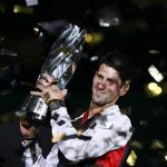 Novak Djokovic of Serbia celebrates with his trophy after winning the men's singles final against Andy Murray of Britain at the Shanghai Masters tennis tournament October 14, 2012. REUTERS/Aly Song