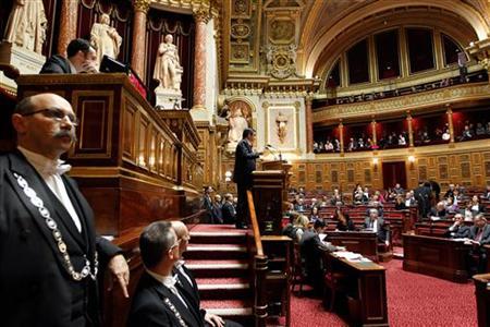 French Prime Minister Francois Fillon (C) delivers a speech during a debate about the right to vote in local elections for foreigners at the French Senate in Paris December 8, 2011. REUTERS/Charles Platiau