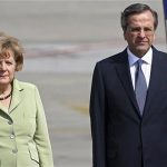 Germany's Chancellor Angela Merkel is welcomed by Greece's Prime Minister Antonis Samaras (R) upon arrival at Eleftherios Venizelos airport near Athens October 9, 2012. REUTERS/Dimitris Doudoumis//ICON