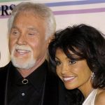 Country singer Kenny Rogers and his wife Wanda pose for photographers as the arrive at the Kennedy Center for the 29th Annual Gala in Washington in this file photo taken December 3, 2006. Rogers offers a revealing look into his life and five-decade-long musical career in "Luck or Something Like It," his memoir that will be released on Tuesday. REUTERS/Mike Theiler