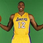New center Dwight Howard poses for photos during NBA media day for the Los Angeles Lakers basketball team in Los Angeles October 1, 2012. REUTERS/Lucy Nicholson