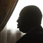 Senegal's President Macky Sall is silhouetted against the light at a meeting with France's Foreign Minister Laurent Fabius, at the presidential palace in Dakar, Senegal July 28 2012. REUTERS/Joe Penney