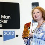 Author Hilary Mantel poses with her book "Bring up the Bodies", after winning the 2012 Man Booker Prize, at the Guildhall in London October 16, 2012. REUTERS/Luke MacGregor