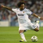 Real Madrid's Marcelo shoots towards the goal during his Champions League Group D soccer match against Manchester City at the Santiago Bernabeu stadium in Madrid, September 18, 2012. REUTERS/Felix Ordonez