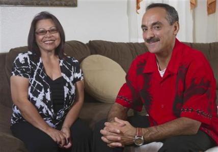 Felisa Medalla and Hubert Pereira pose in their home in Las Vegas, Nevada October 5, 2012. REUTERS/Steve Marcus
