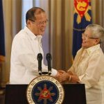 Philippine President Benigno Aquino shakes hands with Presidential Adviser on the Peace Process, Secretary Teresita Quintos-Deles after his speech on national television at the Malacanang palace in Manila October 7, 2012. REUTERS/Cheryl Ravelo