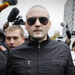Left Front opposition movement leader Sergei Udaltsov (C) arrives at the the Investigative Committee in Moscow October 11, 2012. REUTERS/Maxim Shemetov