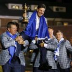 Team Europe captain Jose Maria Olazabal (C) of Spain is lifted up by golfers Lee Westwood (L) and Graeme McDowell (R) after the closing ceremony of the 39th Ryder Cup at the Medinah Country Club in Medinah, Illinois, September 30, 2012. REUTERS/Mike Blake