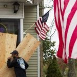 Hurricane Sandy: US states begin storm shutdow