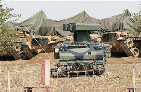 A mobile missile launcher is positioned at a military base on the Turkish-Syrian border at Suruc in Sanliurfa province A mobile missile launcher is positioned at a military base on the Turkish-Syrian border at Suruc in Sanliurfa province, October 6, 2012. REUTERS/Murad Sezer