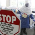 A doctor works in a laboratory on collected samples of the Ebola virus at the Centre for Disease Control in Entebbe, about 37 km (23 miles) southwest of Uganda's capital Kampala, August 2, 2012. REUTERS/Edward Echwalu