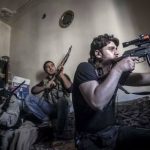 A-rebel-sniper-aims-at-Syrian-army-positions-in-the-Jedida-district-of-Aleppo-as-Syrian-fighter-jets-pound-rebel-areas-across-the-country-with-scores-of-airstrikes