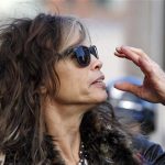 Aerosmith's Steven Tyler adjusts his sunglasses in Boston, Massachusetts November 5, 2012. REUTERS/Jessica Rinaldi