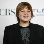 Actor Angus T. Jones poses at the CBS comedies' season premiere party in Los Angeles September 17, 2008. REUTERS/Mario Anzuoni