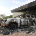 A burnt car is parked at the U.S. consulate, which was attacked and set on fire by gunmen on September 11, in Benghazi September 12, 2012. REUTERS/Esam Al-Fetori