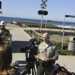 Lt. Erik Raney, Santa Barbara County Sheriff's spokesperson, answers questions during a media briefing following a shark attack in the waters off of Vandenberg's Surf Beach, near Vandenberg Air Force Base, Califoria in this handout photograph released by the U.S. Air Force on October 23, 2012. REUTERS/SSgt Levi Riendeau/U.S. Air Force Photo/Handout