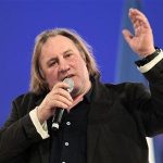 French actor Gerard Depardieu delivers a speech during a campaign rally for France's President Nicolas Sarkozy, candidate for the 2012 French presidential election, in Villepinte, northern Paris March 11, 2012. REUTERS/Charles Platiau