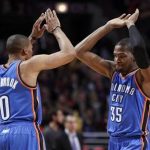 Oklahoma City Thunder point guard Russell Westbrook (0) and Kevin Durant (35) celebrates after a made basket against the Chicago Bulls during the first second of their NBA basketball game in Chicago, Illinois, November 8, 2012. REUTERS/Jeff Haynes