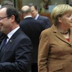 France's President Francois Hollande (L) walks past Germany's Chancellor Angela Merkel (R) during a summit of European Union leaders discussing the European Union's long-term budget in Brussels November 22, 2012. European Union negotiators believe they are close to securing British and German backing for a deal on nearly a trillion euros of spending over the next seven years, but last minute concessions may be needed to secure French and Polish support. REUTERS/Yves Herman