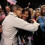 Keesha Patterson of Ft. Washington, Maryland (L) kisses her girlfriend Rowan Ha (R) after proposing marriage, during the election night victory rally at re-elected President Barack Obama headquarters in Chicago, November 6, 2012. REUTERS/Kevin Lamarque/Files