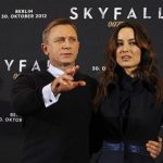 Cast members Daniel Craig (L) and Berenice Marlohe pose for photographers during a photocall to promote their film "Skyfall" in Berlin October 30, 2012. The film opens in German cinemas on November 1. REUTERS/Tobias Schwarz