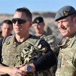Actor Daniel Craig (L) speaks to military personnel during a visit to Camp Bastion in Helmand Province, Afghanistan November 18, 2012. Craig, who plays James Bond in the 007 secret agent films, met British soldiers and introduced the latest Bond film "Skyfall", which was being shown at the camp. REUTERS/Cpl Neil Bryden RAF/MoD/Crown Copyright/Handout