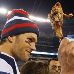 New England Patriots quarterback Tom Brady holds up a turkey leg after they defeated the New York Jets in their NFL football game in East Rutherford, New Jersey, November 22, 2012. REUTERS/Gary Hershorn
